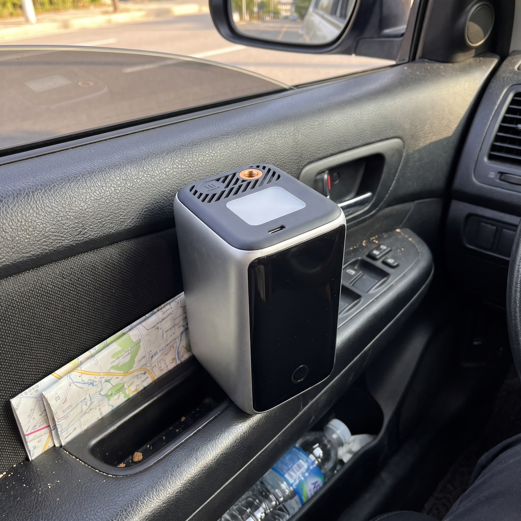 The JumpAir Pro standing in a car door pocket in daylight